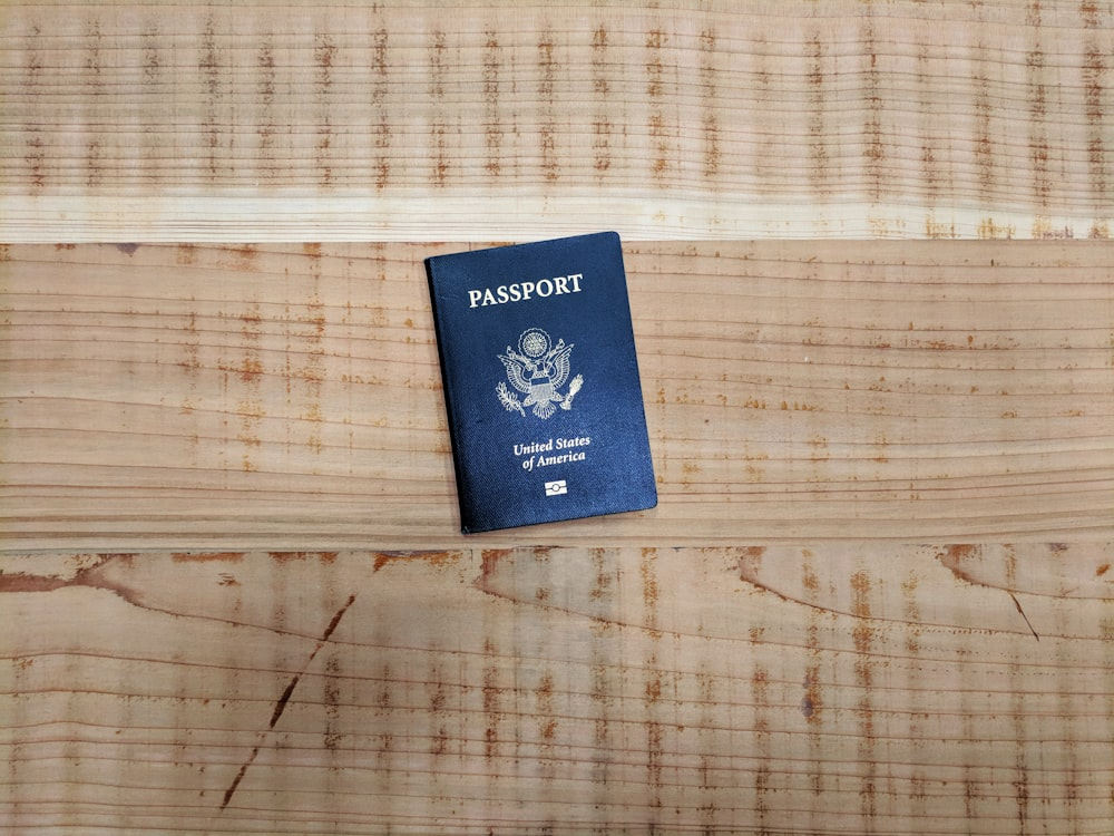 A US Passport on a wooden surface