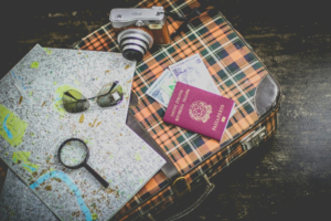 A variety of travel-related items, representing the importance of having all travel documents in order.