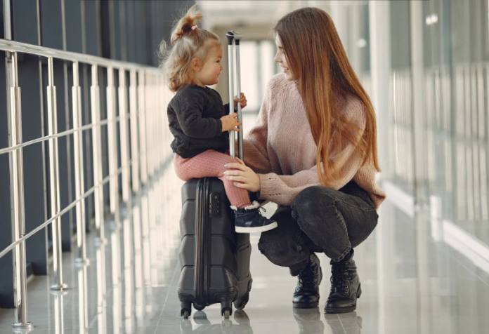 A mother with her daughter at the airport