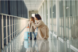 A mother and daughter in an airport 